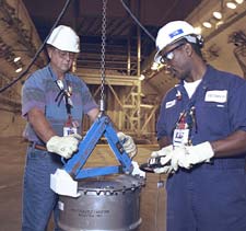 Using an A-Frame lifting hoist to safely relocate 9975s in the K Area Material Storage Facility.