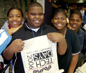 Students interacting with SRS employee