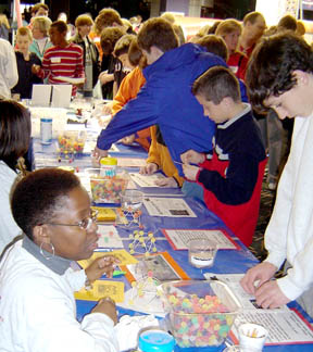 Students operating Tech Days display