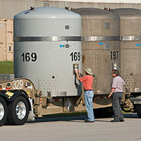 Solid Waste Management employees verify data prior to shipping transuranic waste to the Waste Isolation Pilot Plant in Carlsbad, NM. 